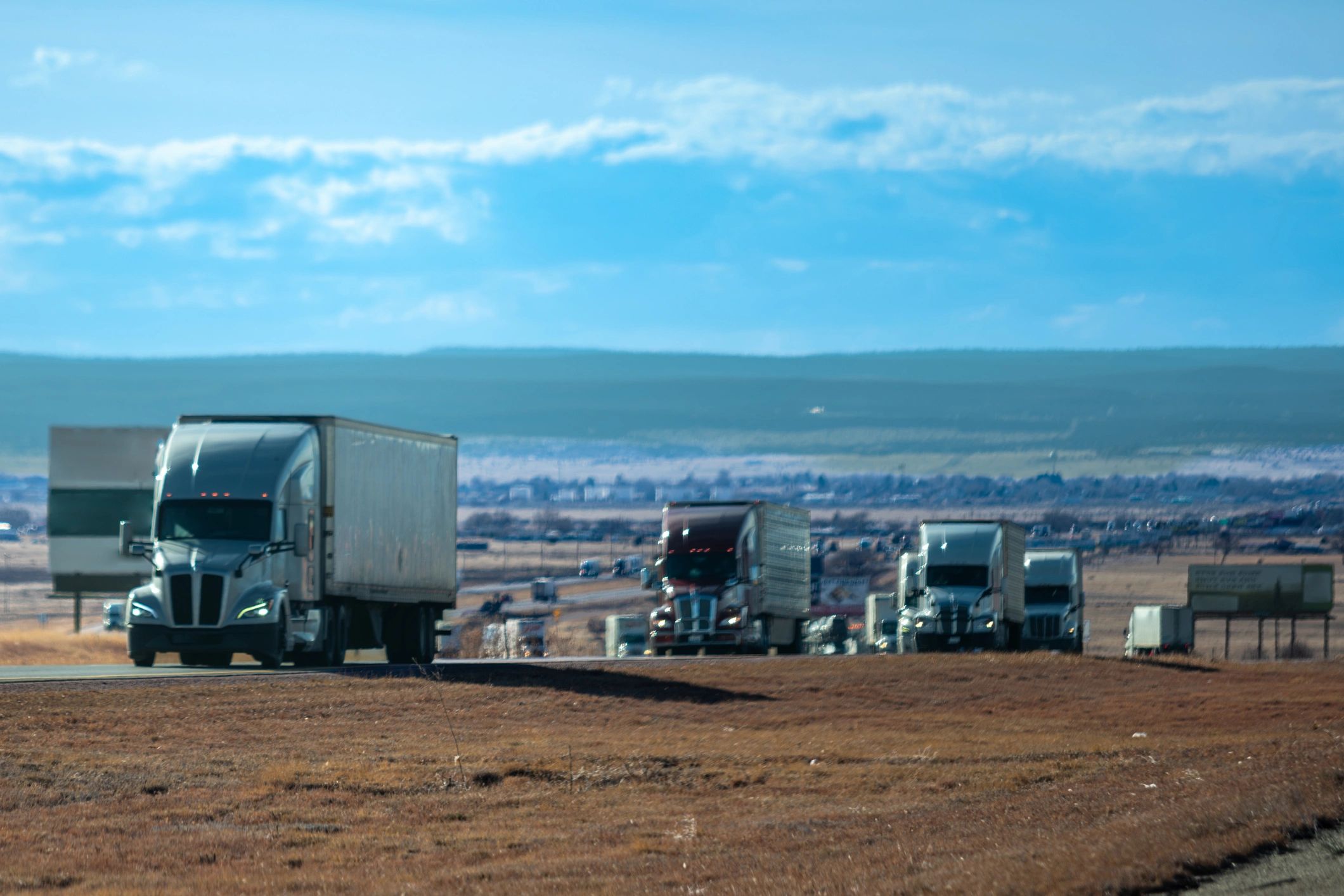 Commercial truck fleet staged for ground transport operations